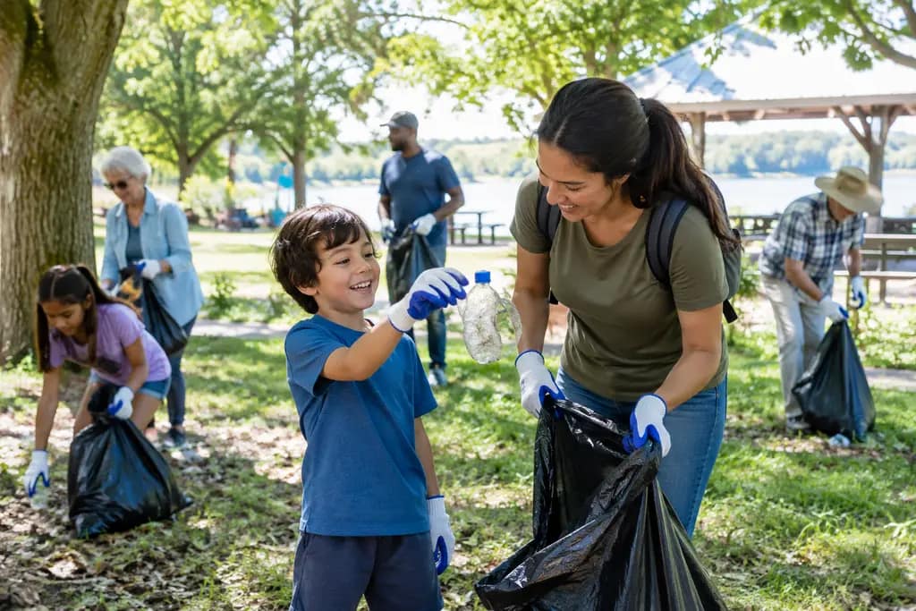 Volunteers gather supplies for a Trinity clean-up day near a public park